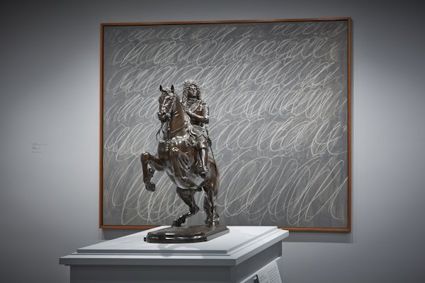 Installation view at The Frick Collection showing Giuseppe Piamontini’s “Prince Ferdinando di Cosimo III on Horseback” with Cy Twombly’s “Untitled” (detail), “Chalkboard” series, 1970, ©Cy Twombly Foundation, both works from the Collection of Mr. and Mrs. J. Tomilson Hill; photo: Michael Bodycomb