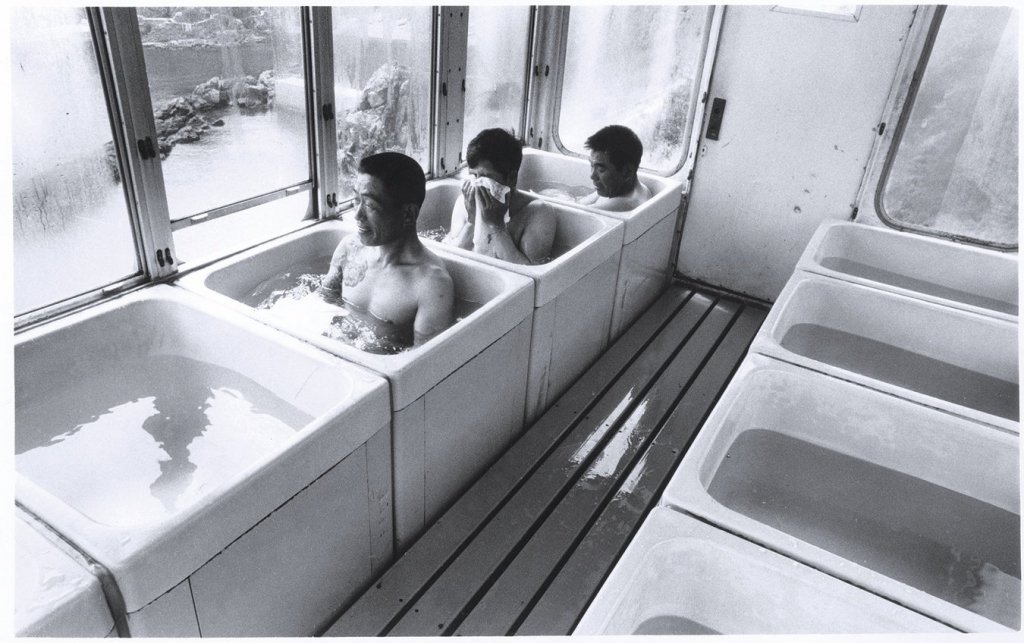 japanese taking a bath on a cable car